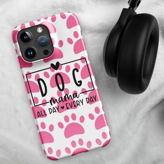 Front of iPhone snap case with a white and pink paw background and black text saying 'Dog Mama All Day Every Day'