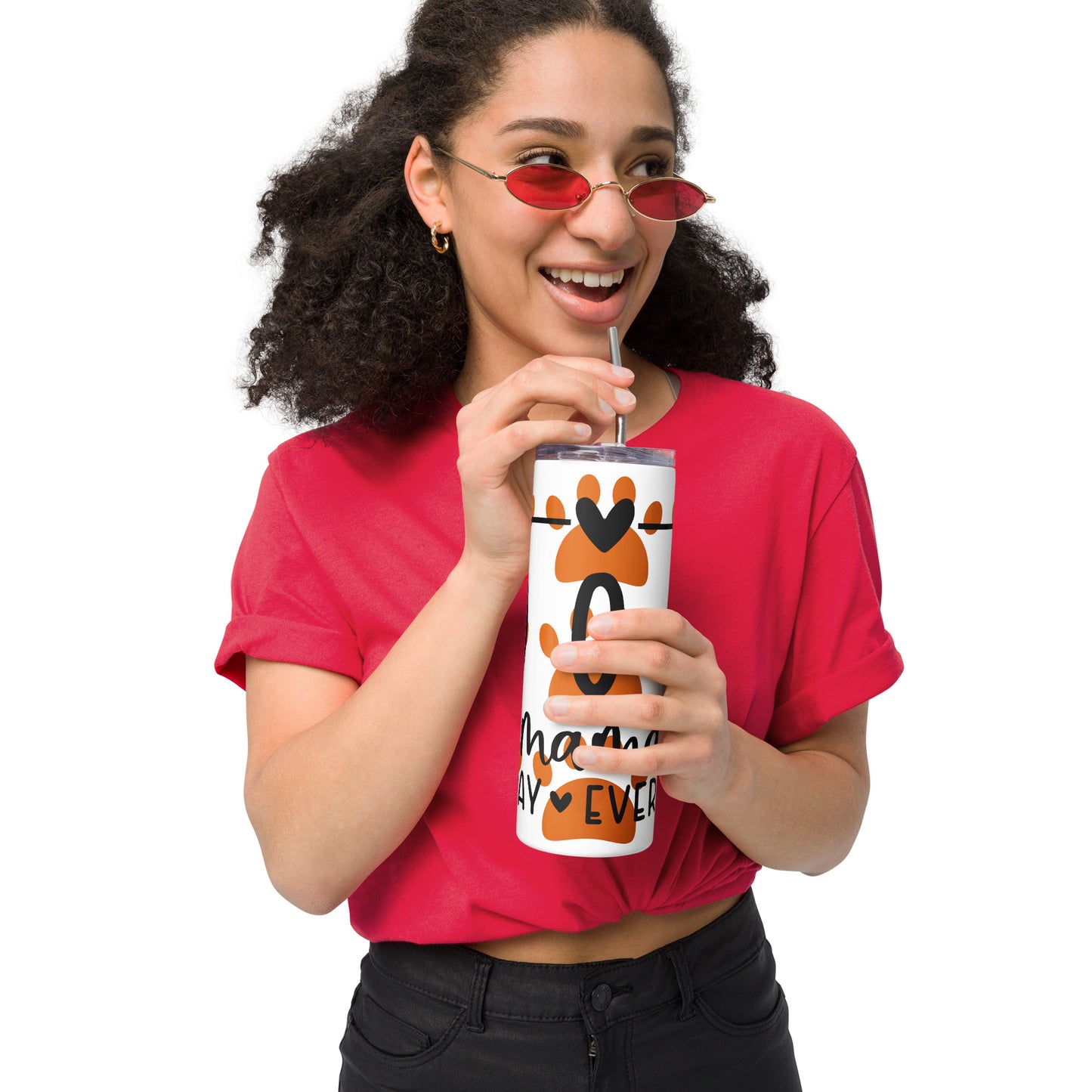 Front of white stainless-steel tumbler with orange paws and text 'Dog Mama, all day everyday' being held by woman