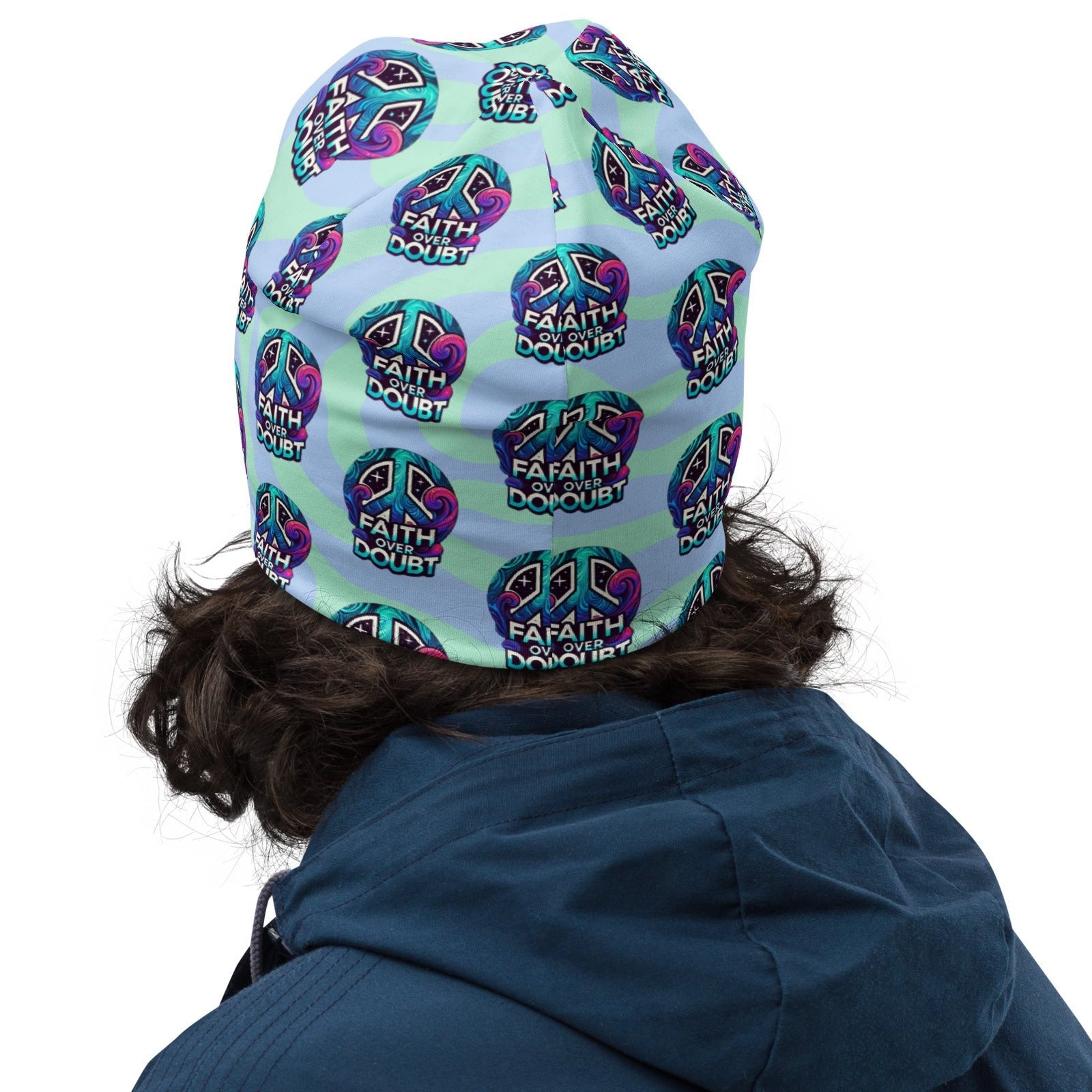 Back of blue patterned beanie with logo saying 'Faith over doubt'