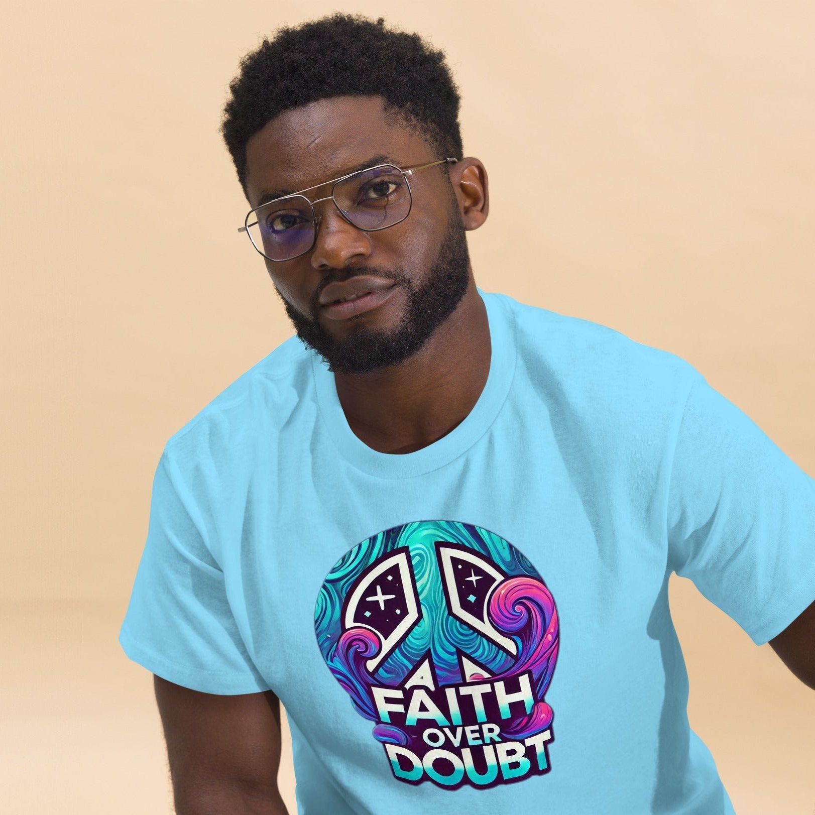 Front of sky t-shirt with blue, pink and purple image of peace sign and text saying 'faith over doubt'