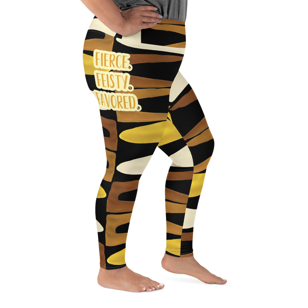 Right view of a woman wearing black, brown, beige and gold print leggings with gold and white text saying 'Fierce.Feisty.Favored.' on right hip 