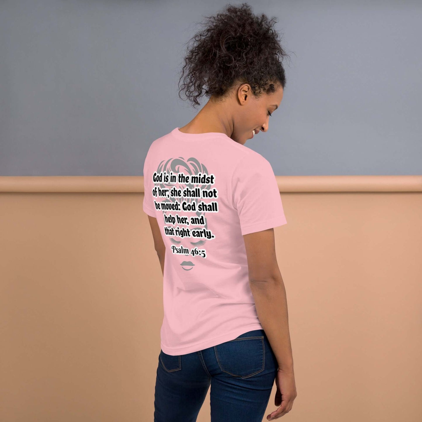 Back of pink t-shirt with grey image of woman's face underneath Psalm 46:3 scripture