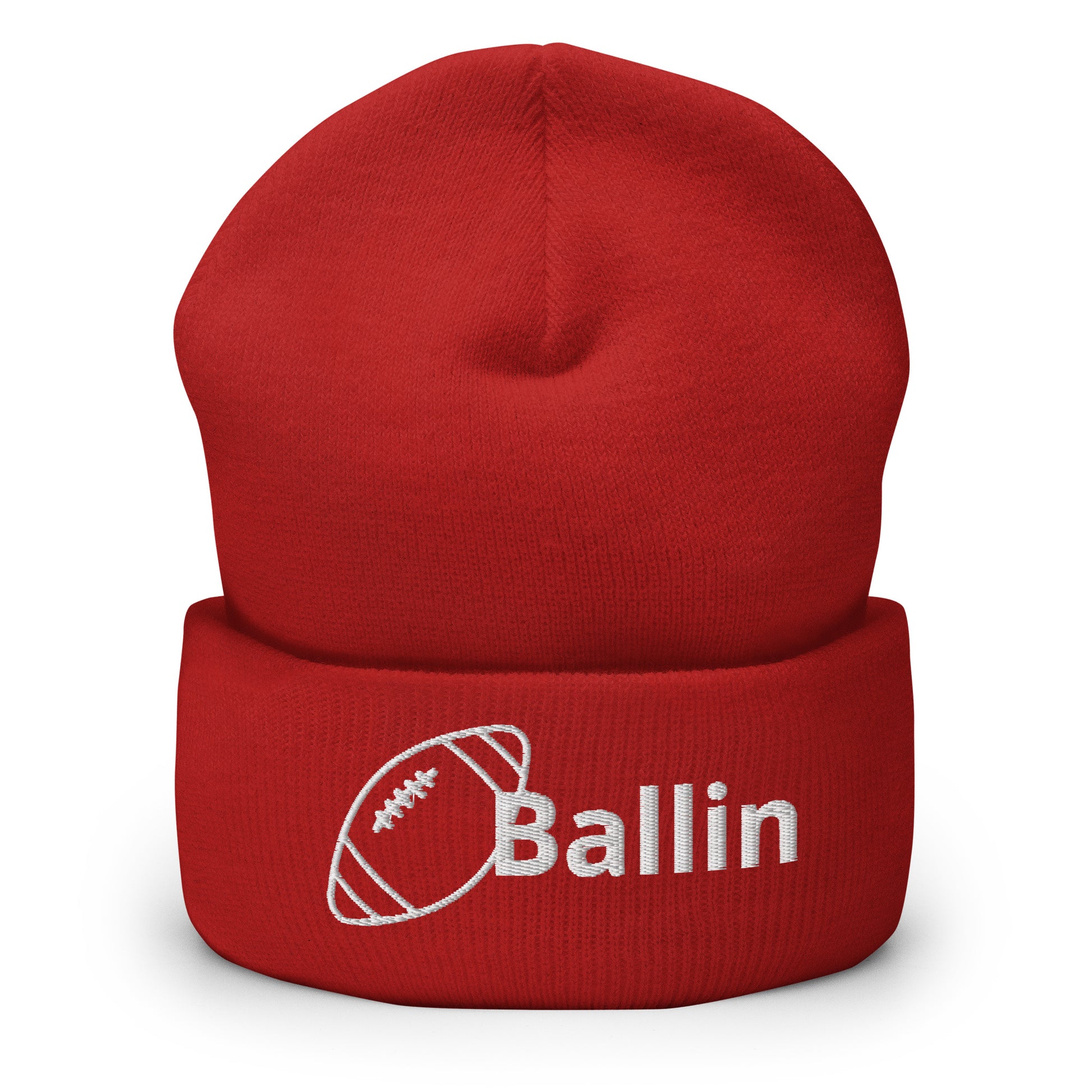 Front of red cuffed beanie embroidered with a white football and black text saying 'ballin'