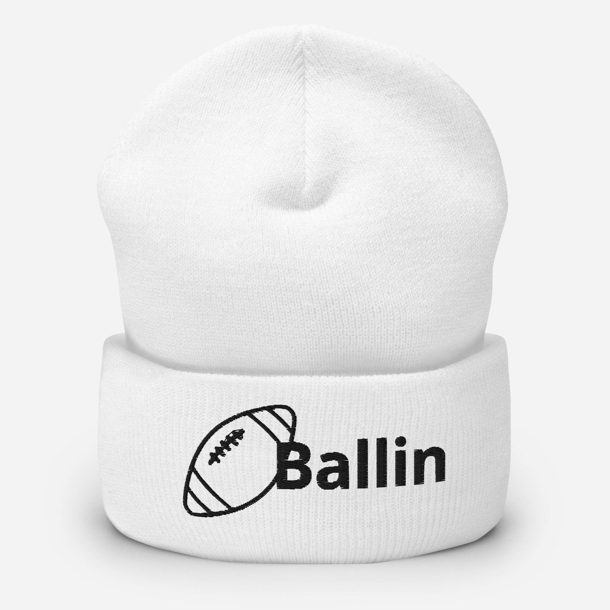 Front of white cuffed beanie embroidered with a black football and black text saying 'ballin'