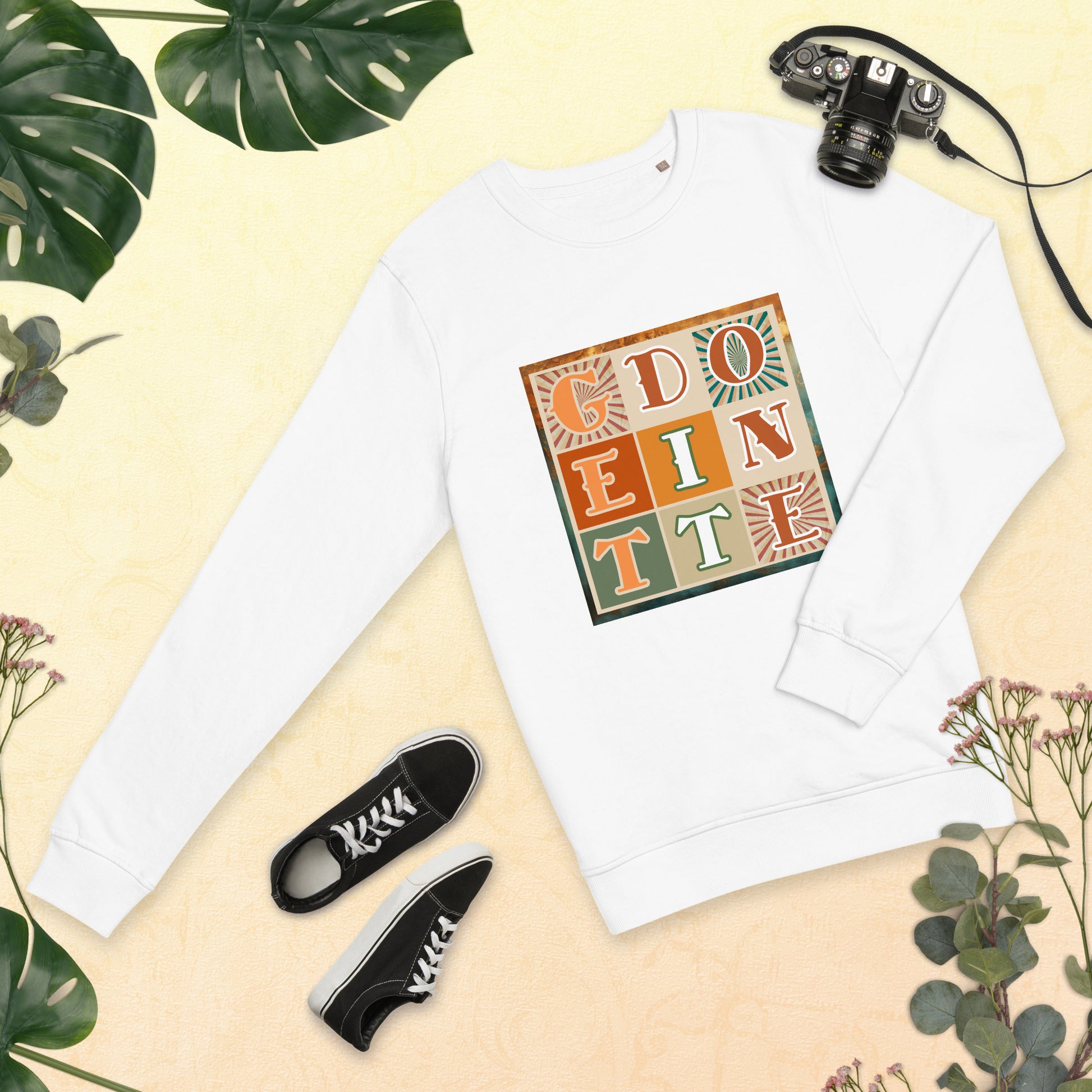 Front of white t-sweatshirt with nine-green, orange and tan square design saying 'Get it done'