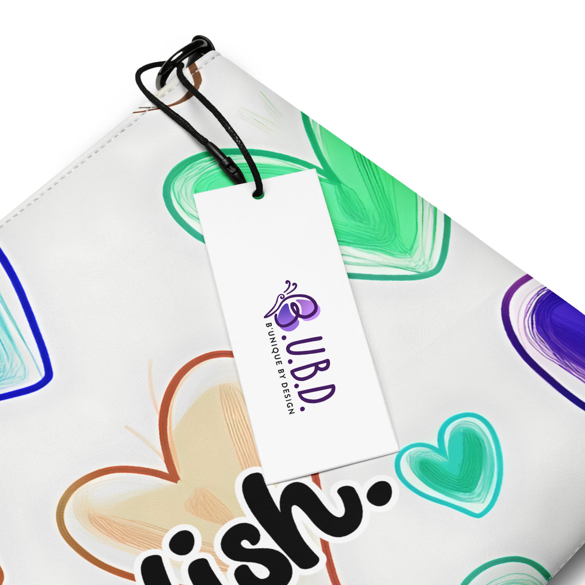 Details of crossbody bag with hearts on white background and 'girlish' text and BUBD tag
