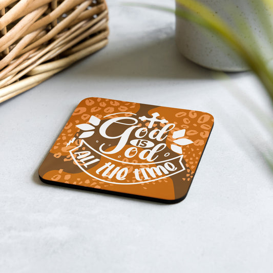 Cork-back-coaster with brown and orange abstract background and text saying 'God is God all the time'