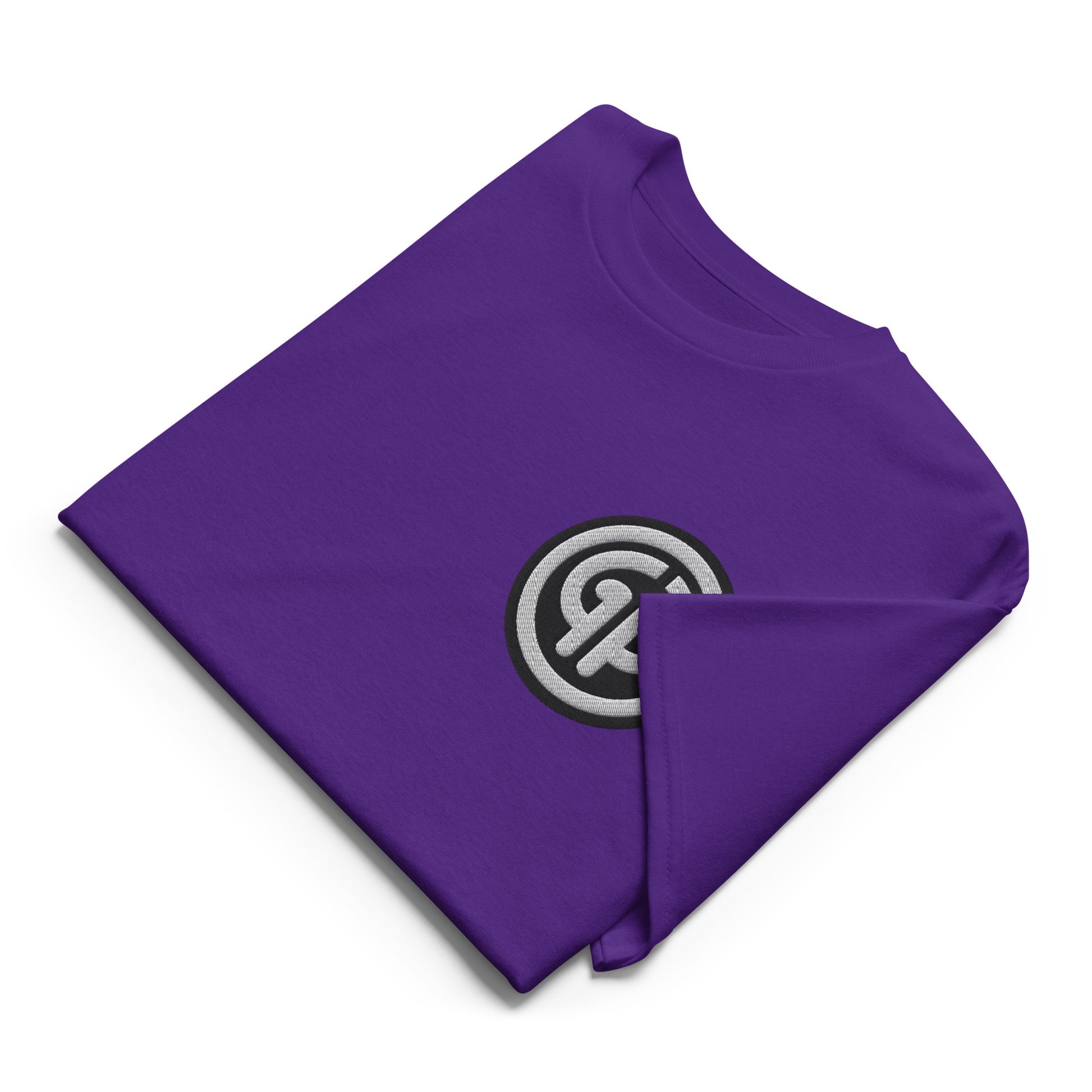Front of folded purple t-shirt with God's Property 'GP' emblem embroidered on left chest