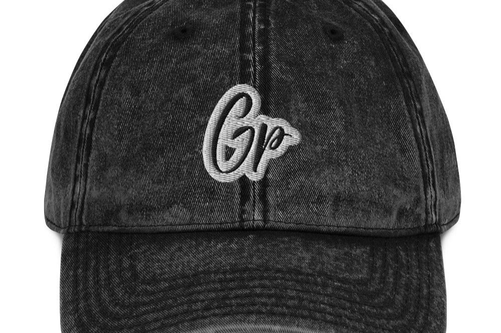 Front of black unisex twill cap with embroidered of 'GP'