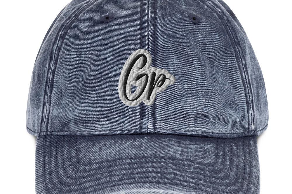 Front of navy unisex twill cap with embroidered of 'GP'