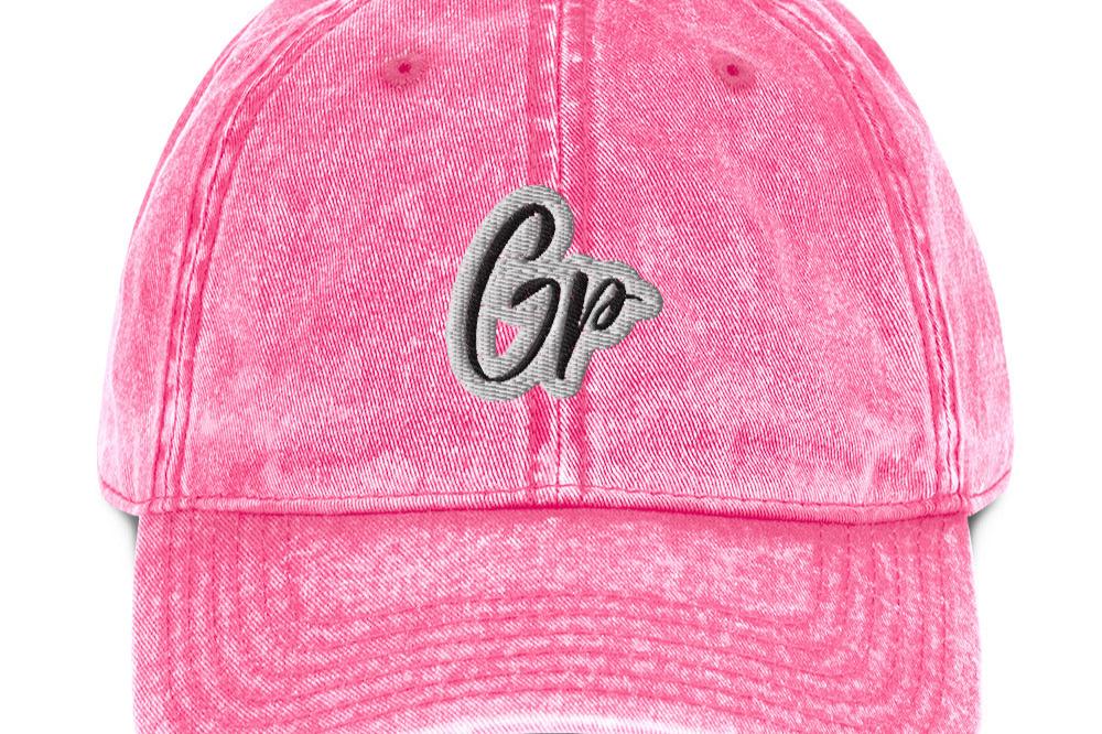 Front of pink unisex twill cap with embroidered of 'GP'