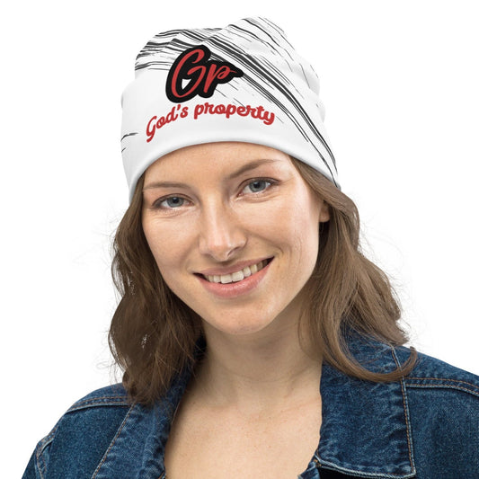 Front of white and black print beanie with text saying 'GP, God's property' in red