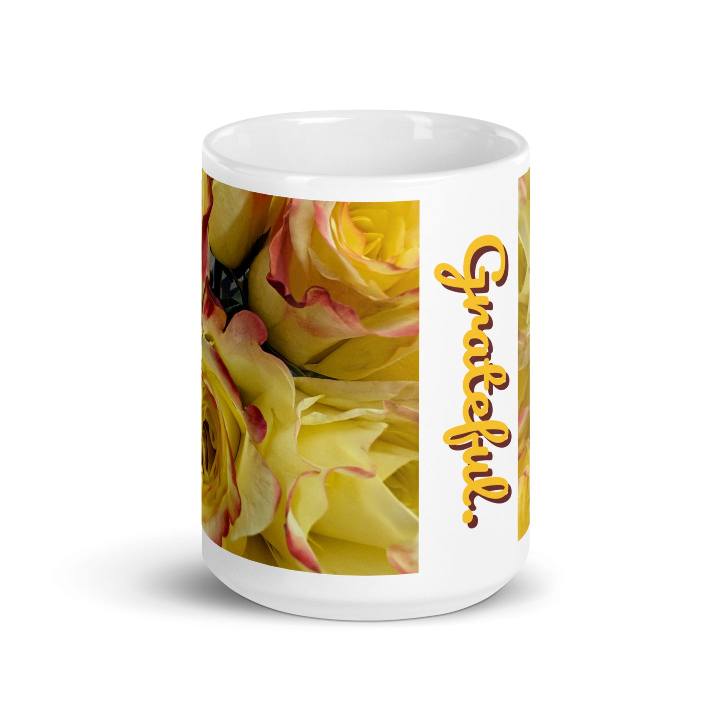 Front view of a 15 oz white glossy mug with gold and burgundy flowered background and text saying 'grateful'