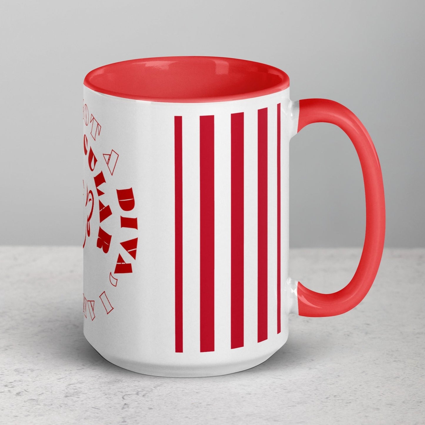 Right view of white mug with red inside and 4 vertical lines, a partial view of outline of woman's face and text saying 'a Diva above the image and 'I am' below on the outside, all in red