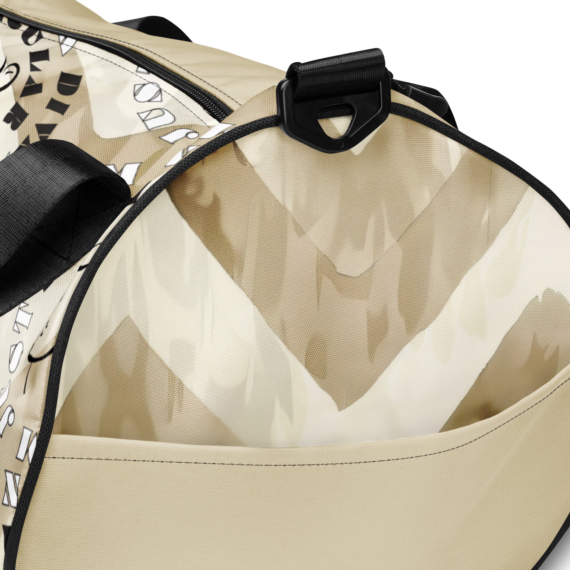 Details of beige print gym bag with icons of woman's face and text saying 'I am not a diva, I am just particular'