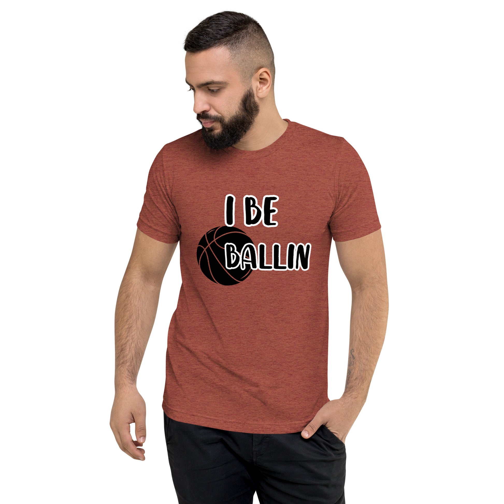 Front of clay t-shirt with image of black basket and black and white text saying 'I Be Ballin'