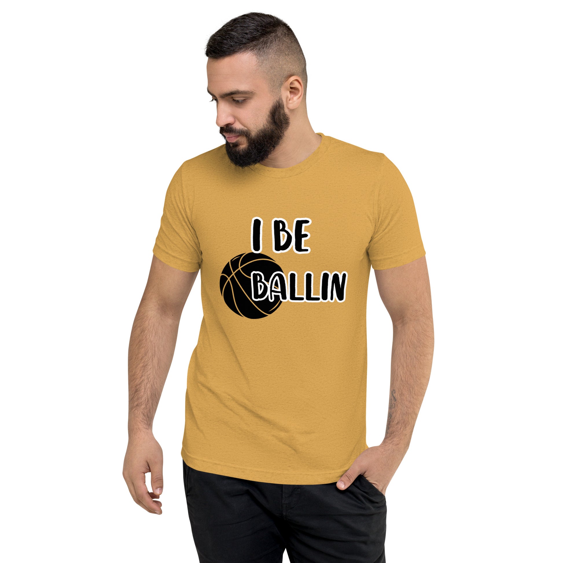 Front of mustard t-shirt with image of black basket and black and white text saying 'I Be Ballin'