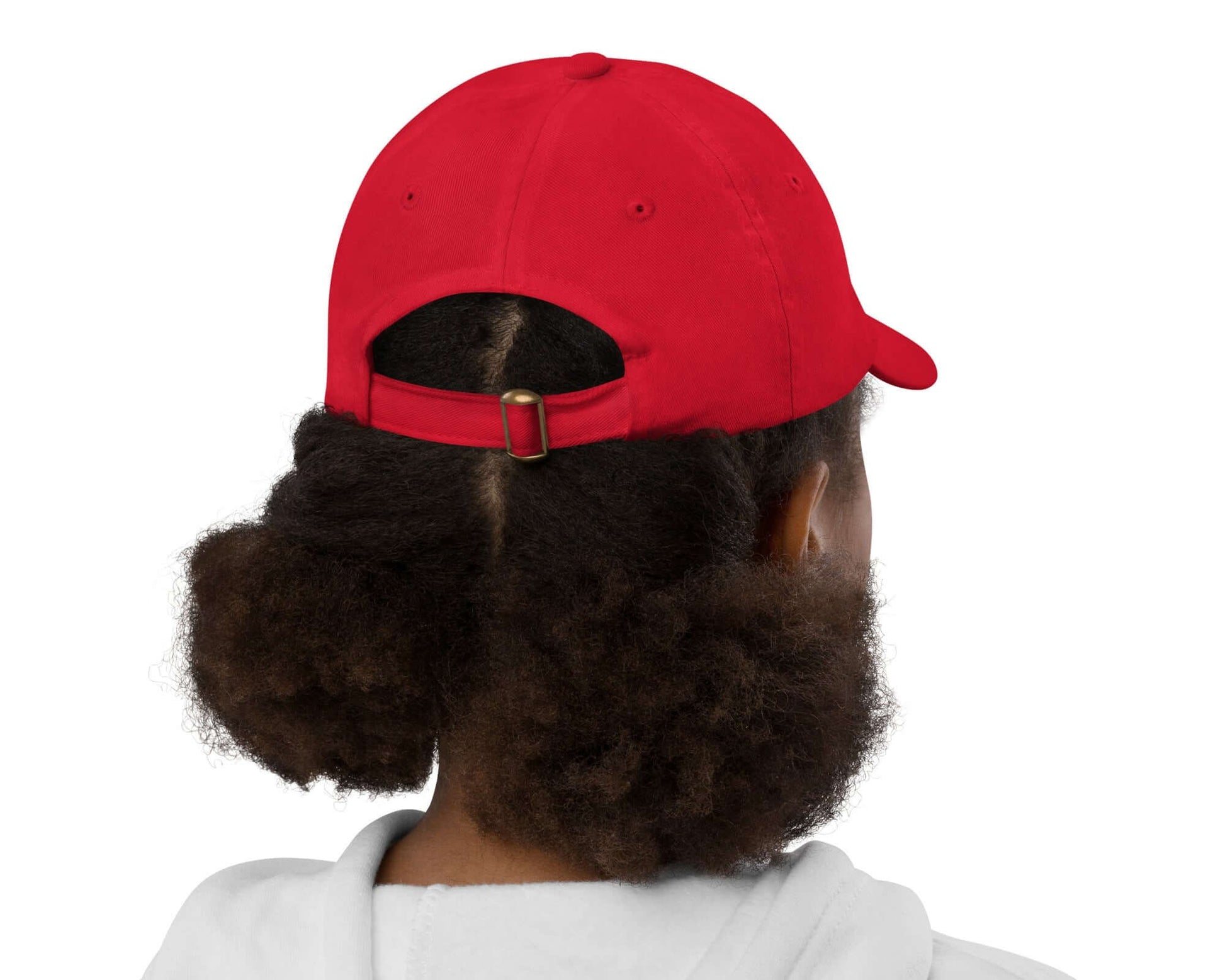 Back view of youth wearing a red baseball cap with text saying 'I am now' across the front