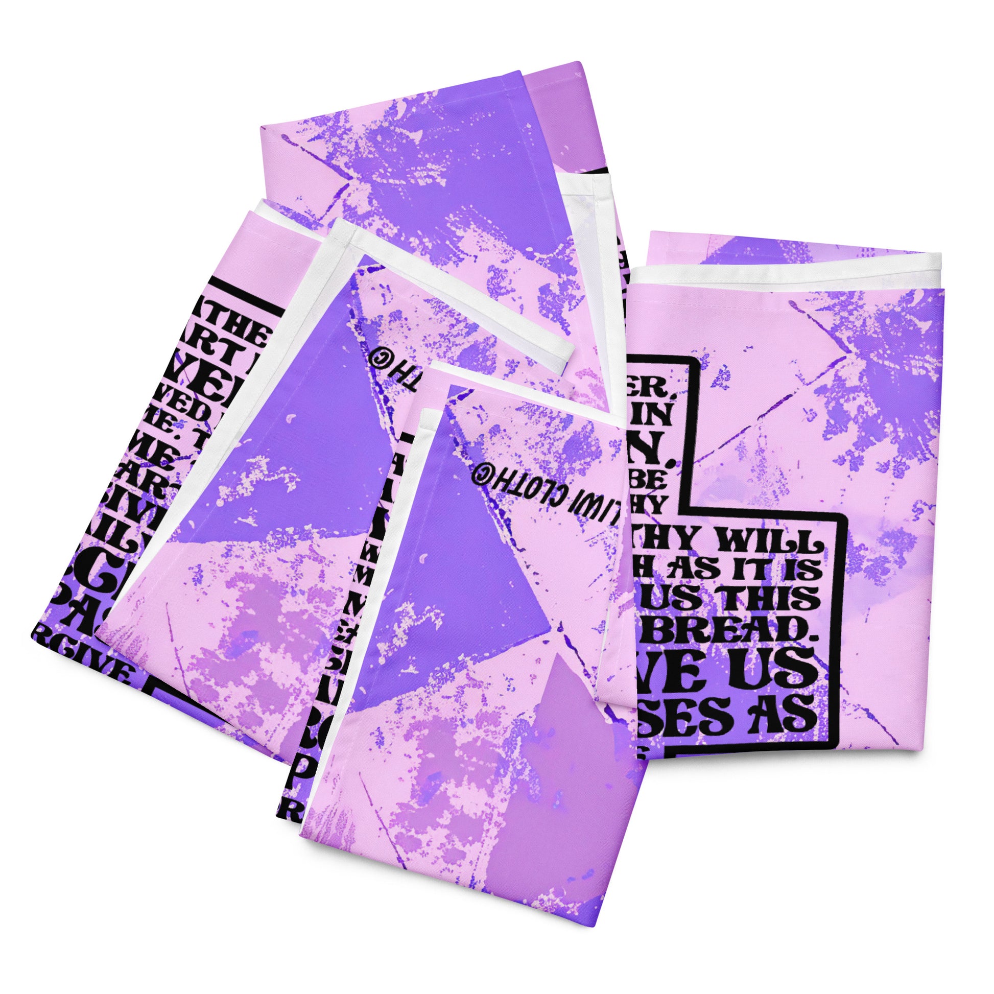 Four folded of LIWI lap cloth with purple abstract background and image of cross with Lord's prayer inside