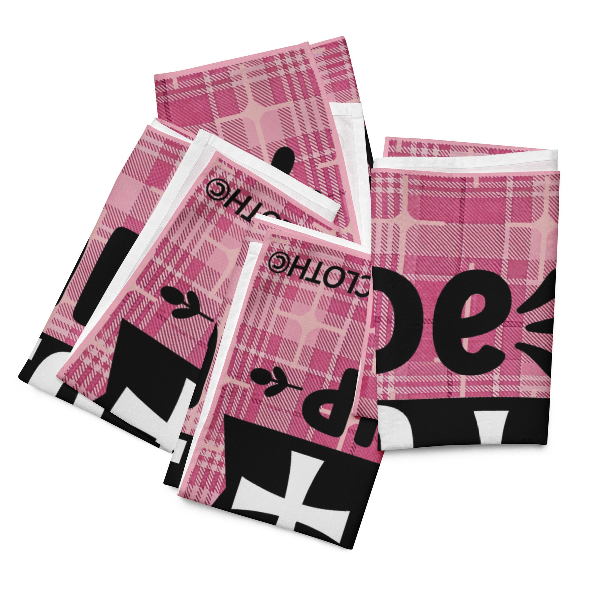 Front of LIWI cloth with pink plaid background and black and white text saying 'made to worship', four cloths