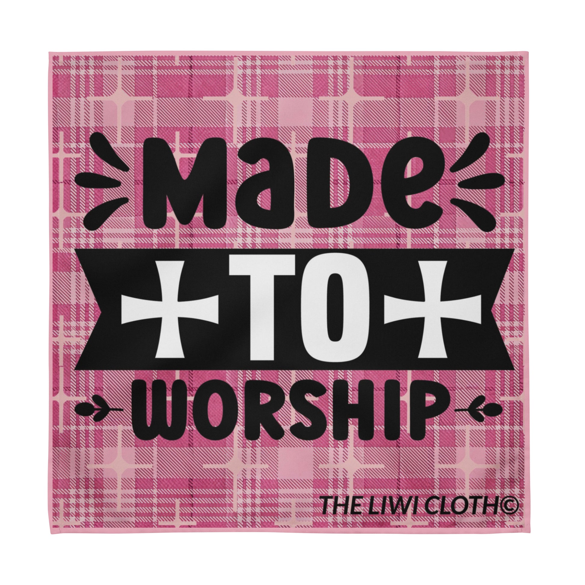 Front of LIWI cloth with pink plaid background and black and white text saying 'made to worship'