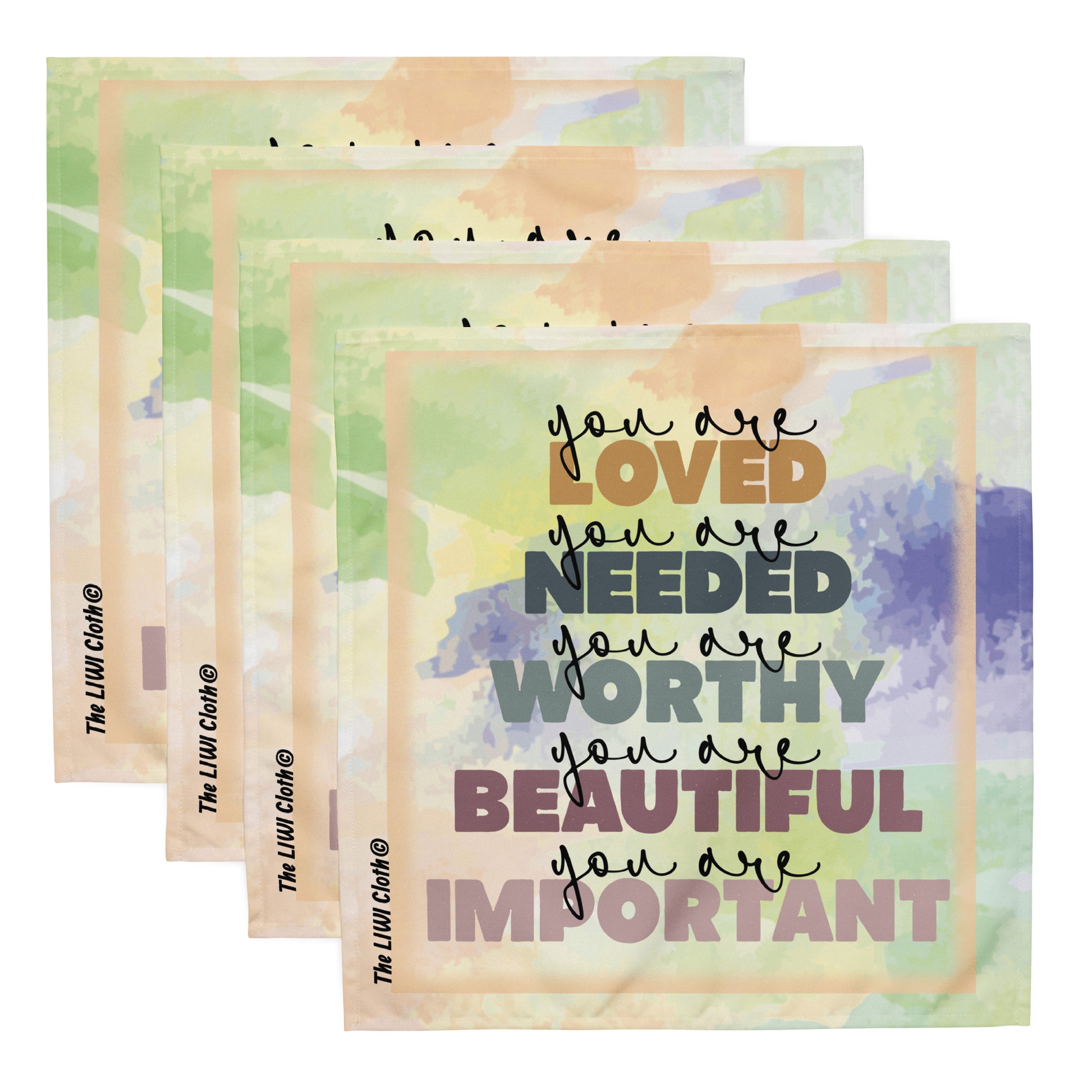 Front of pastel LIWI cloth with multicolored text saying 'you are loved, you are needed, you are worthy, you are beautiful, you are important' four napkins