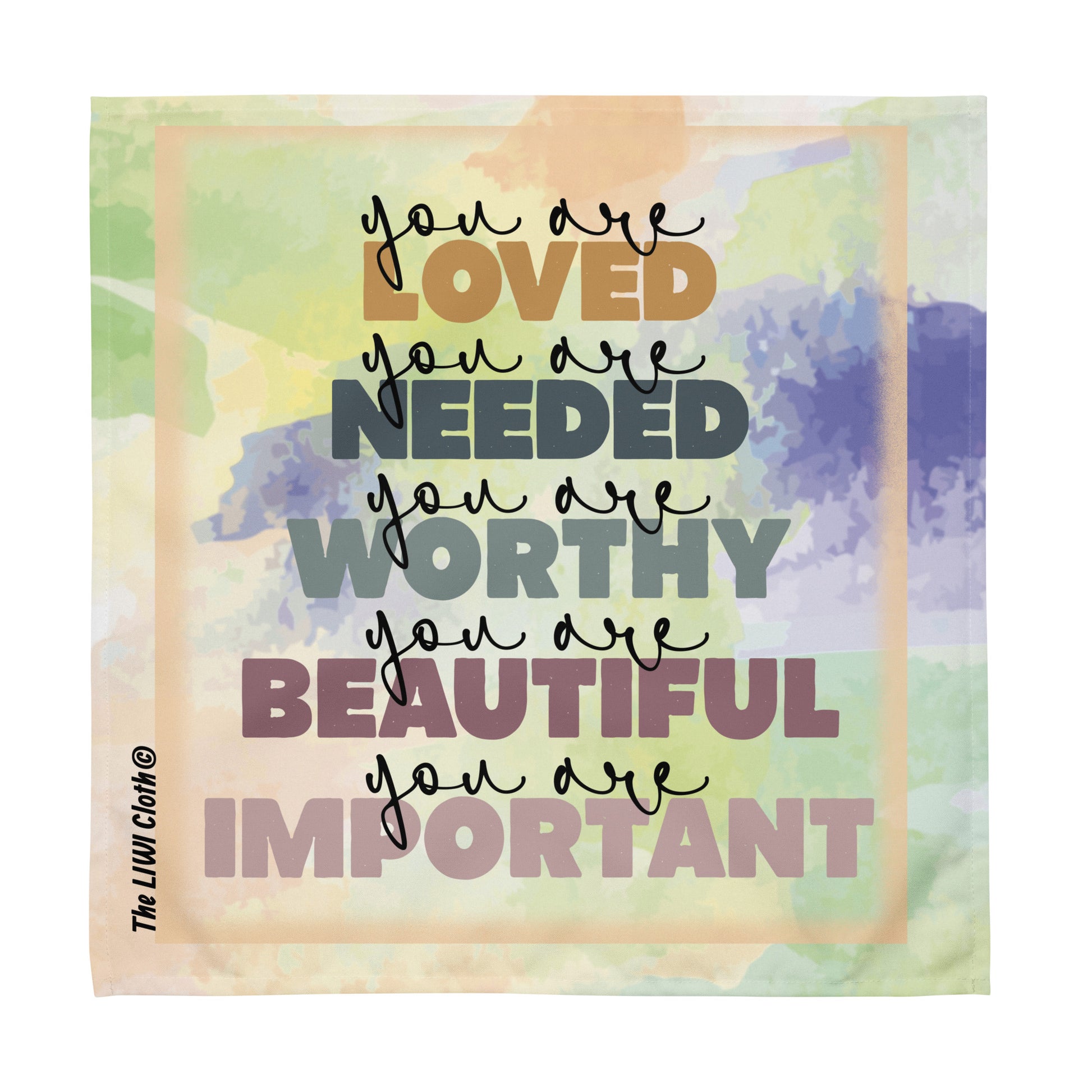 Front of pastel LIWI cloth with multicolored text saying 'you are loved, you are needed, you are worthy, you are beautiful, you are important'