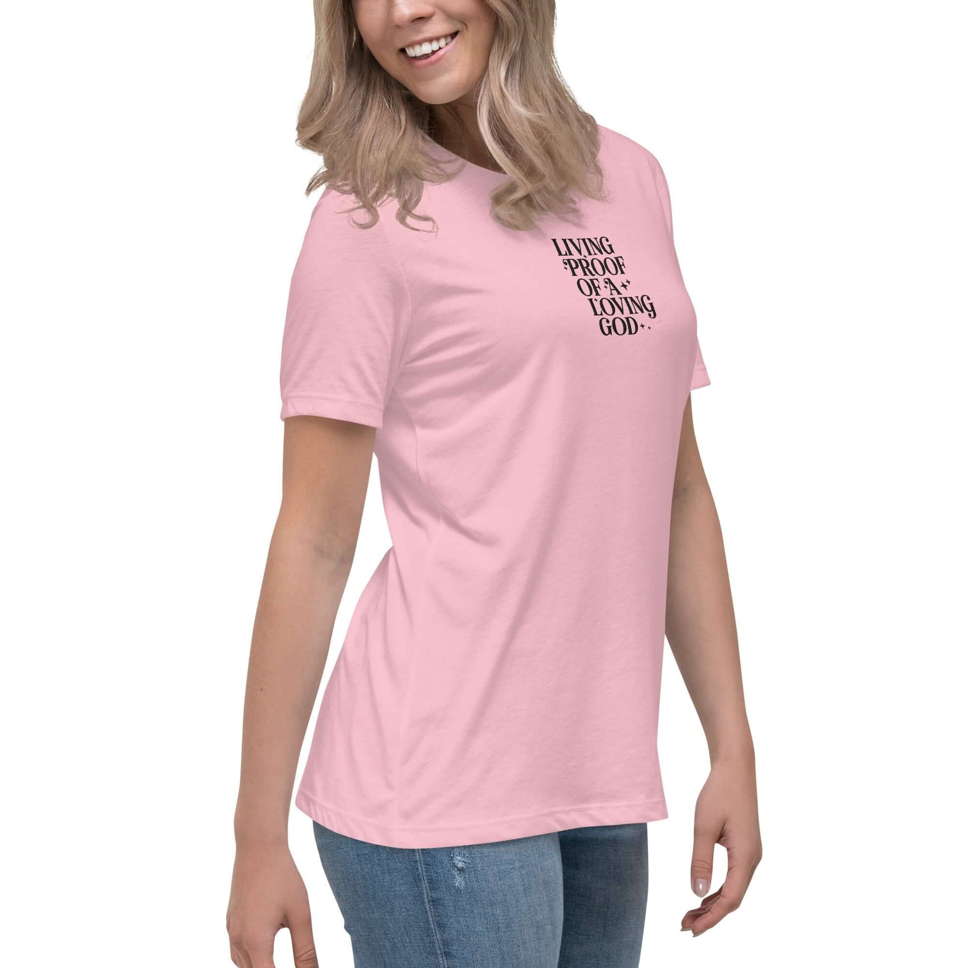 Right front of pink t-shirt with embroidered text saying 'living proof of a loving God'