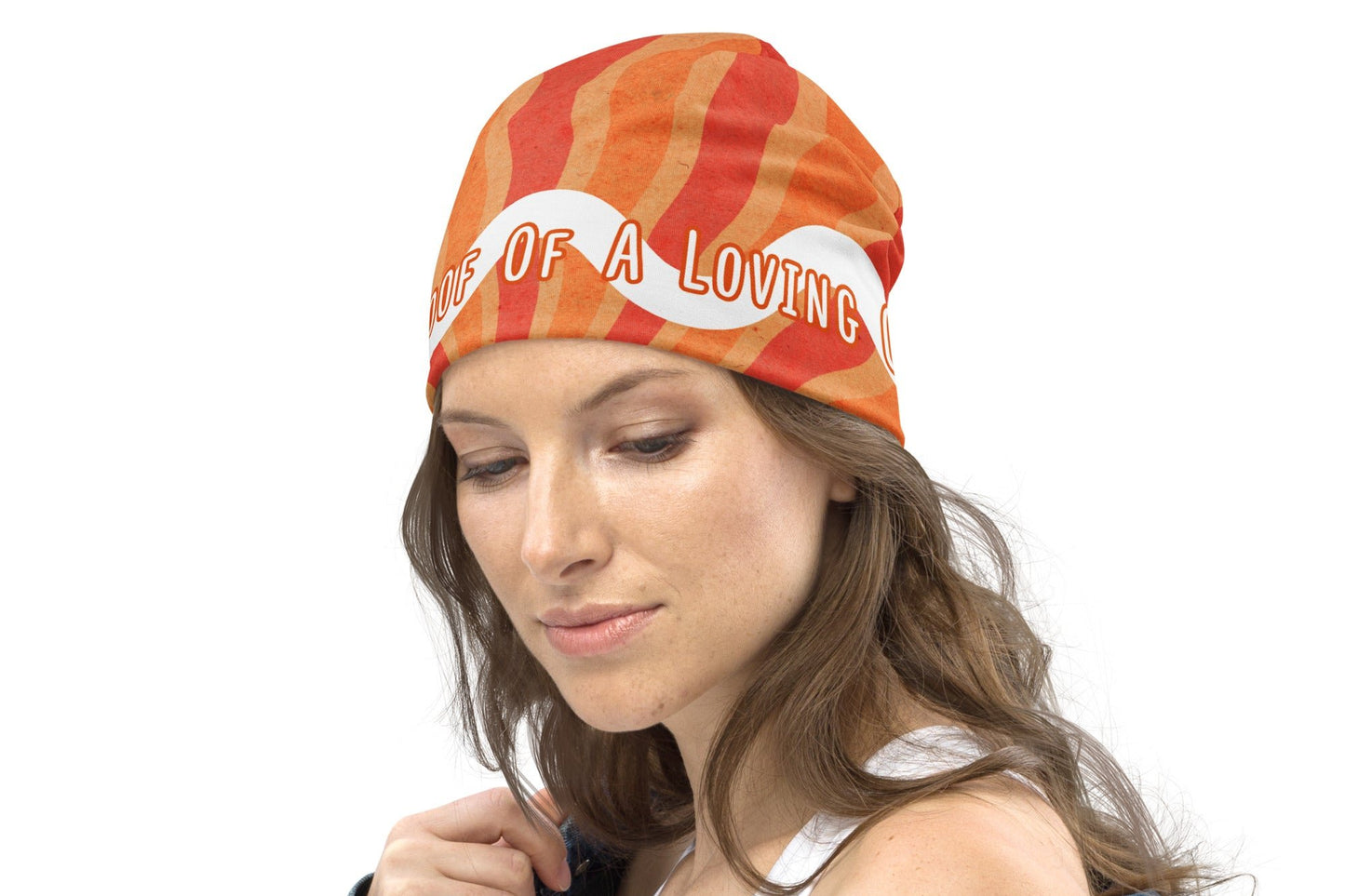 Left right of orange and white beanie with text saying 'Living proof of a loving God'