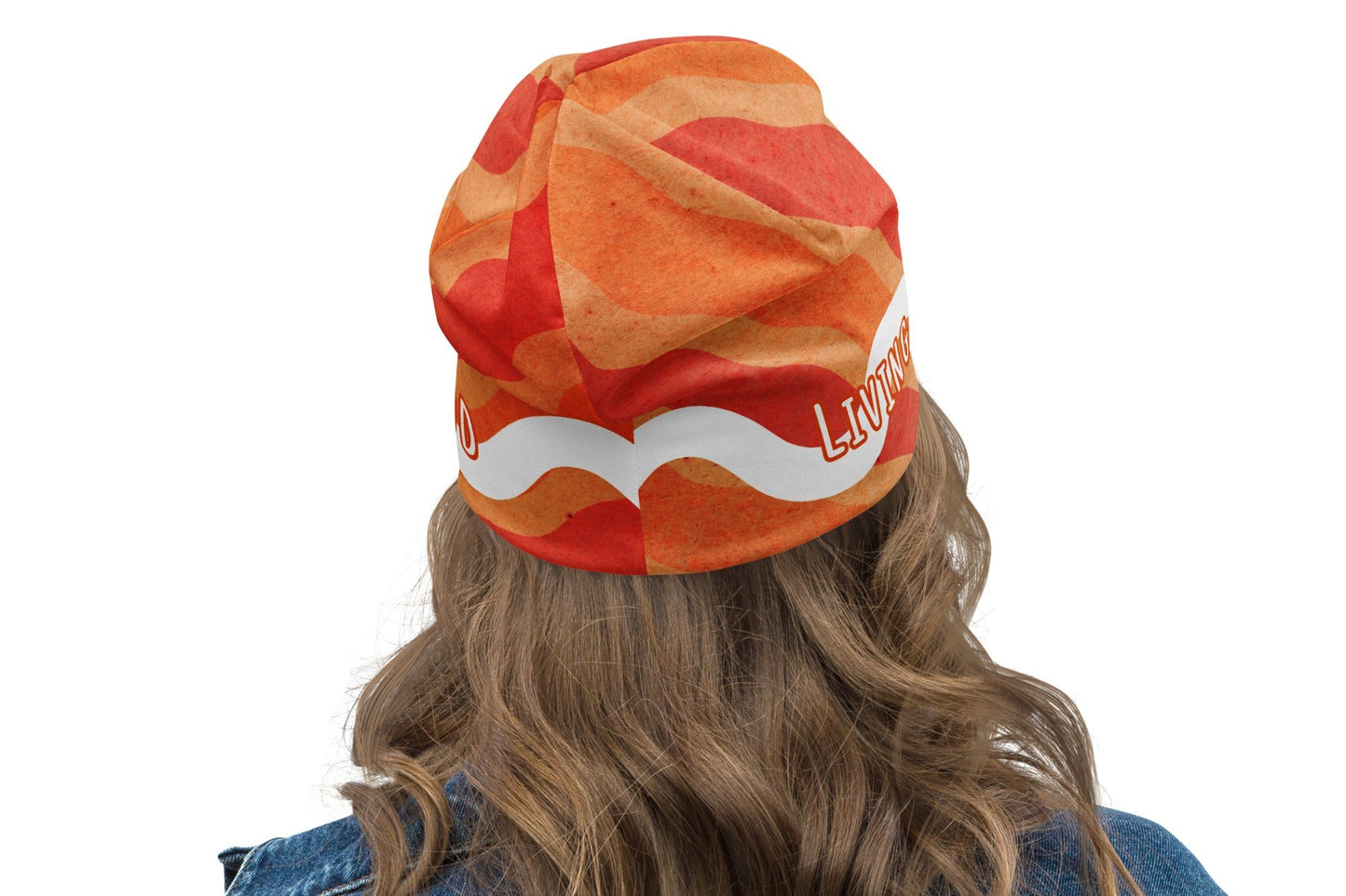 Back of orange and white Living Proof beanie