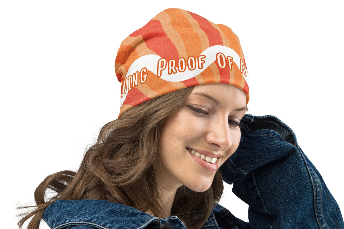 Front right of orange and white beanie with text saying 'Living proof of a loving God'