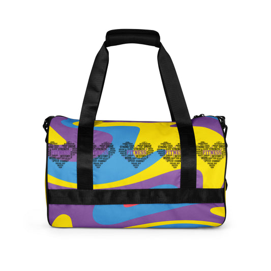 Back of multi-colored purple, gold, blue gym bag with heart icons saying 'fitness' in center
