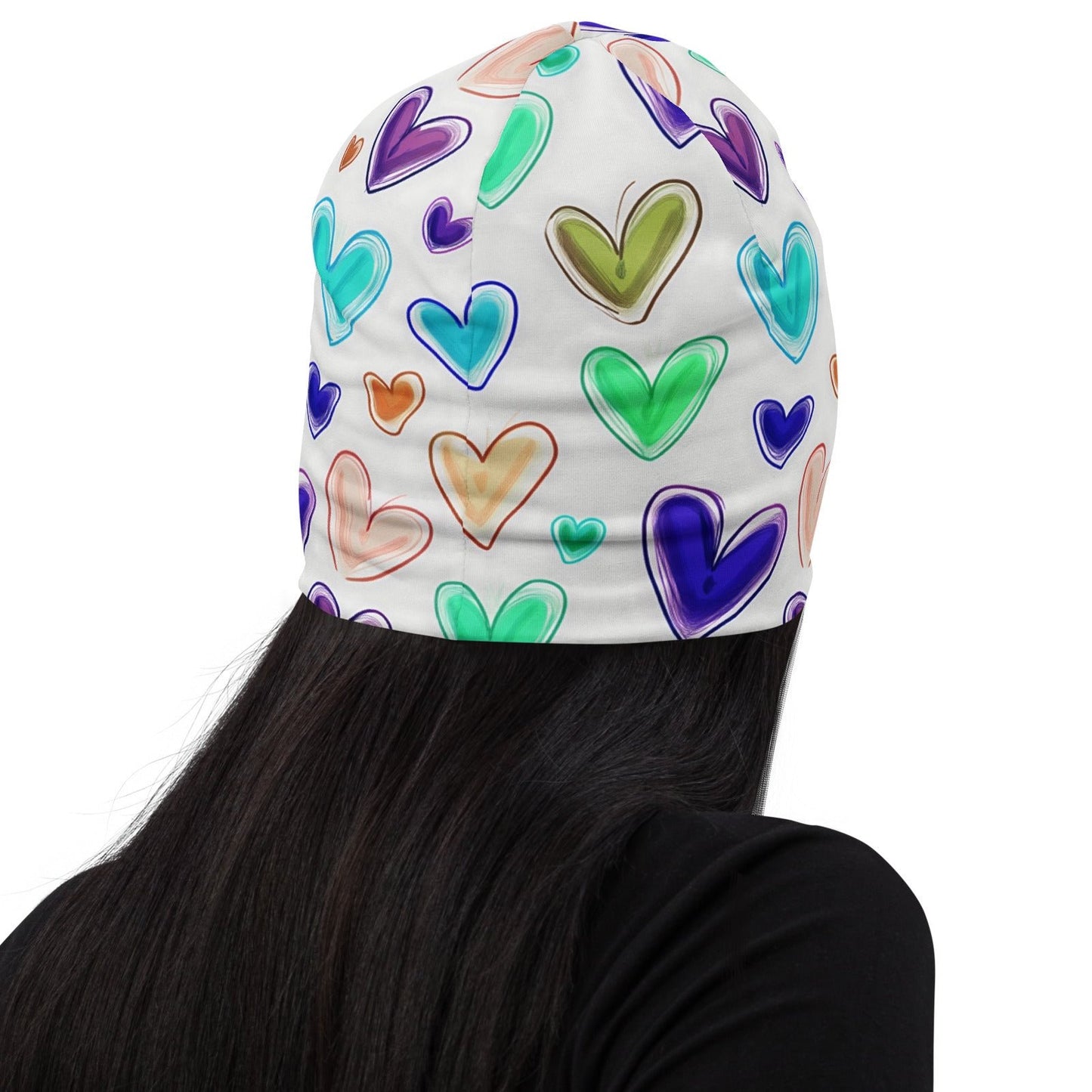 Back of white beanie with multicolored hearts