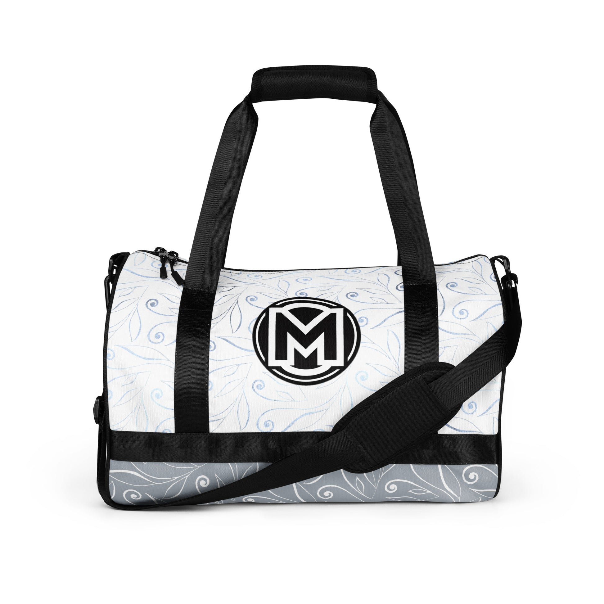 Front of light blue gym bag with blue swirl background and 'M' logo