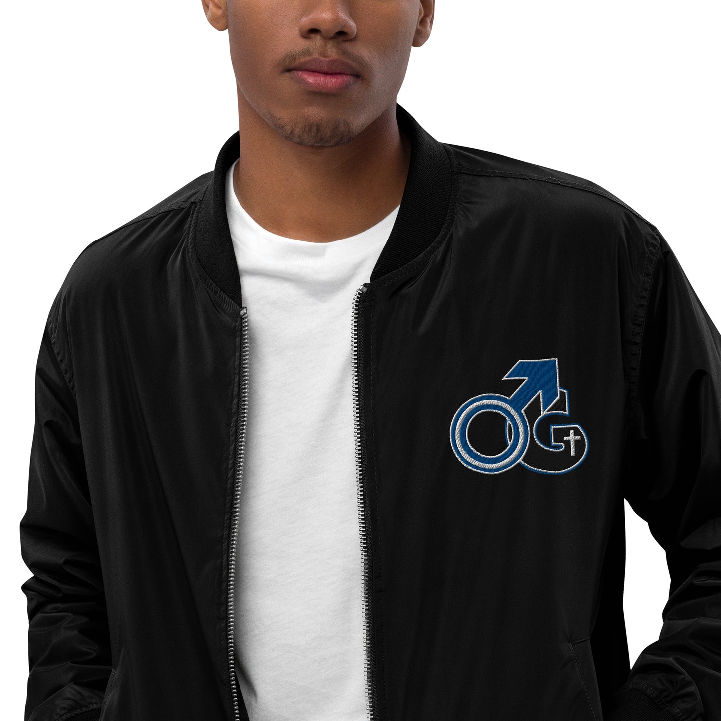 Front zoomed of black bomber zippered jacket with black and white symbol representing Man of God on top left