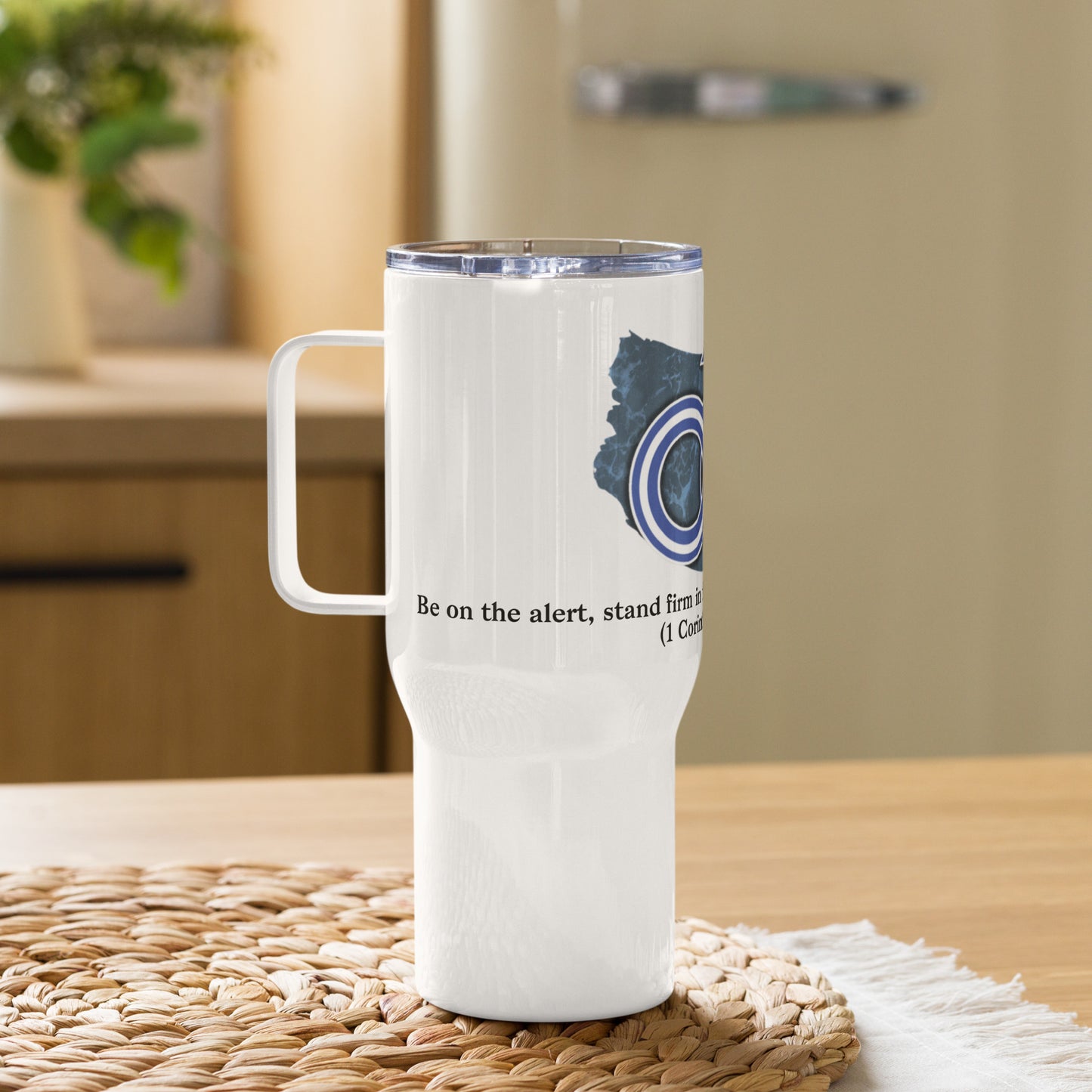 Left view of 25 oz white travel mug with partial view of white, blue and black image representing man of God text from Corinthians 16:13 on the front