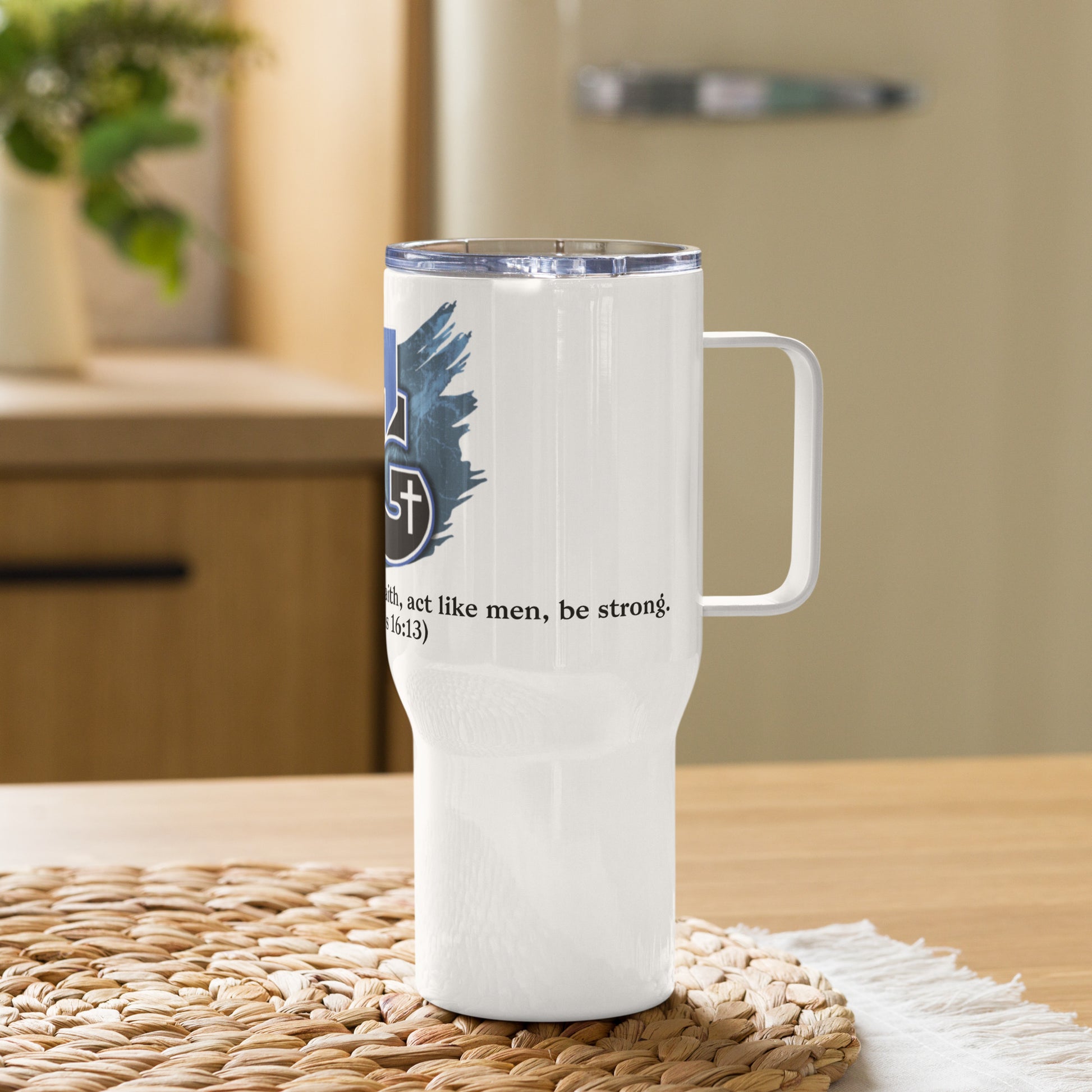 Right view of 25 oz white travel mug with partial view of white, blue and black image representing man of God text from Corinthians 16:13 on the front