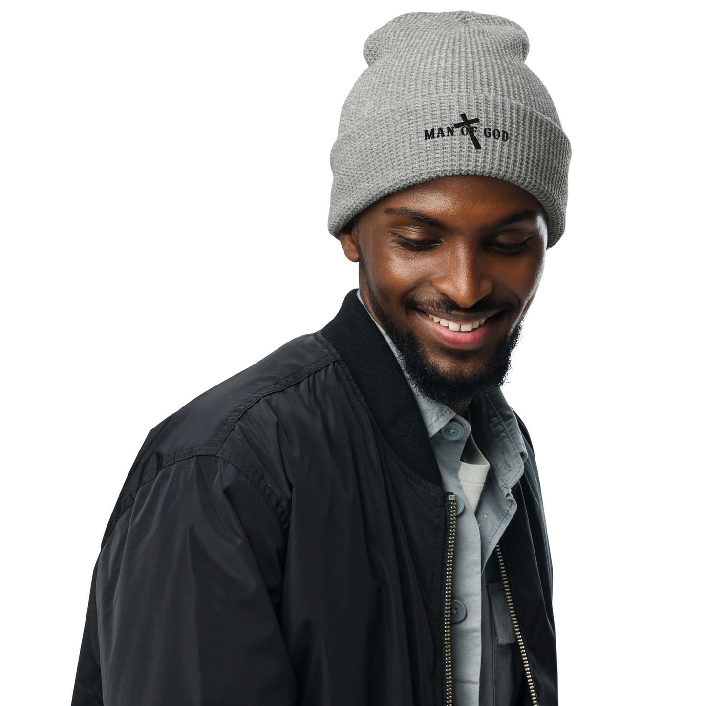 Front of grey waffle beanie with embroidered black symbol of Man of God and cross