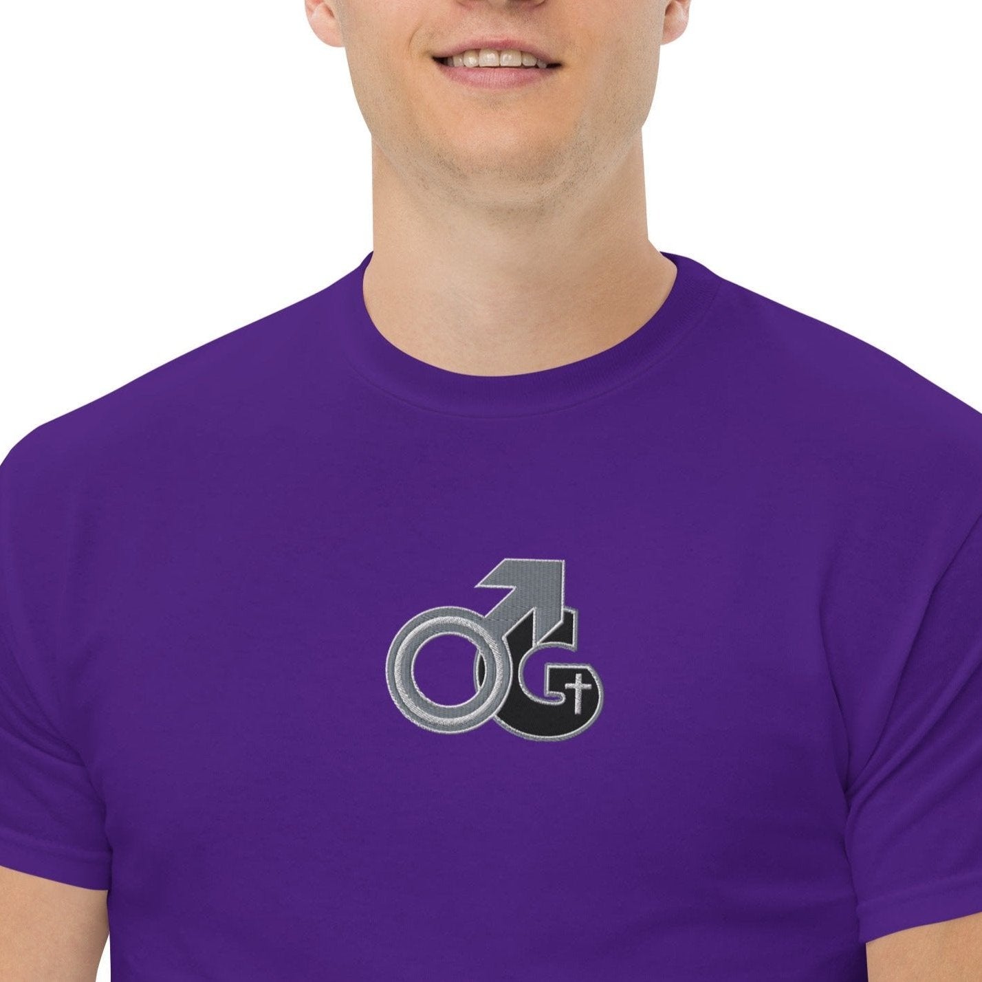 Front of purple t-shirt with black, gray and white embroidered symbol representing Man of God