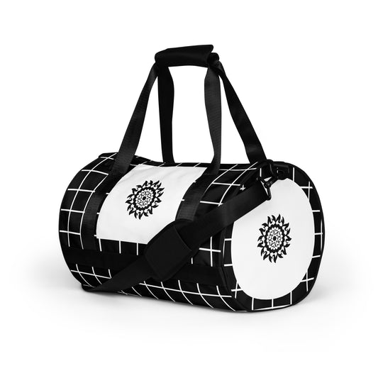 Left front of black and white print gym bag with black mandala 