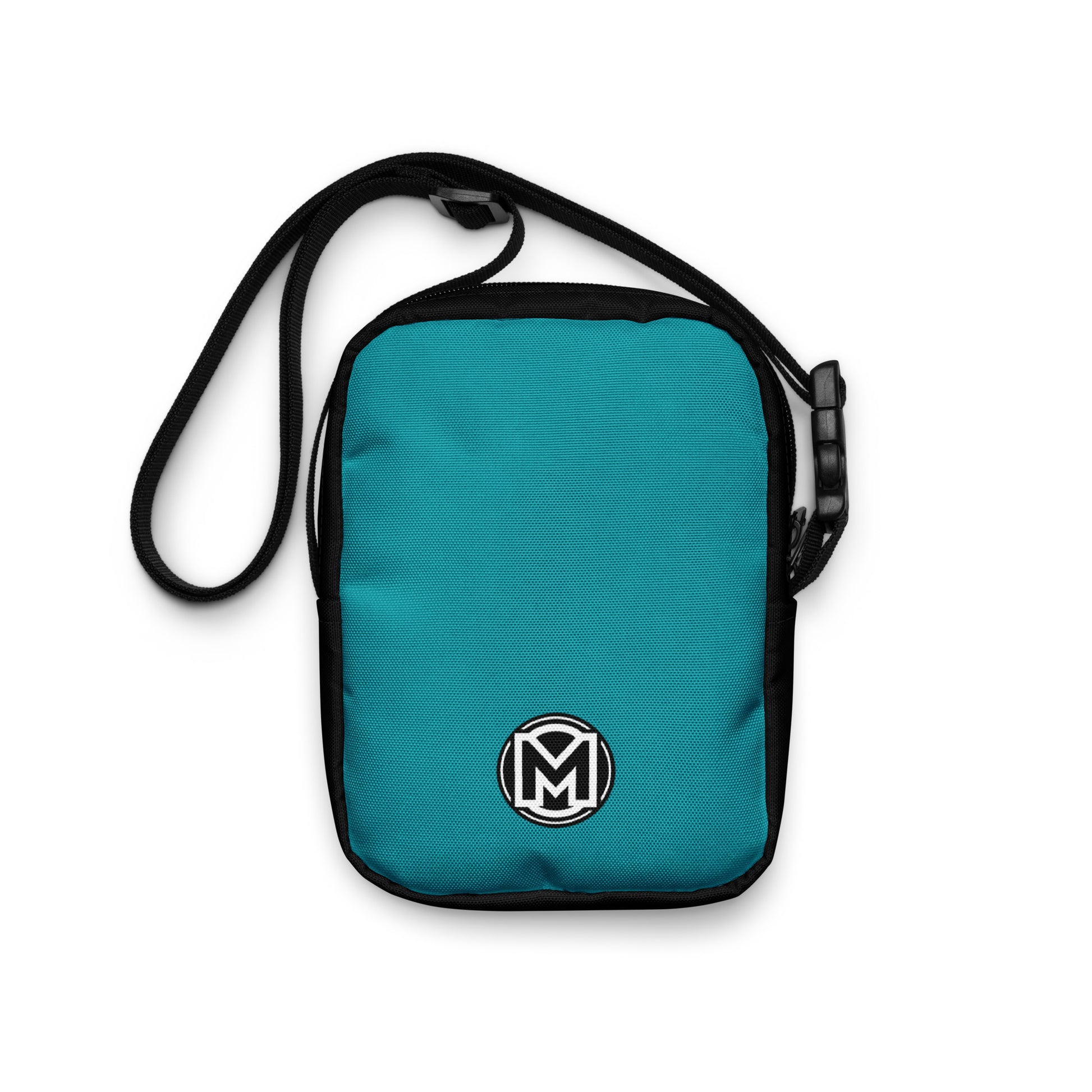 Back view of Manly Cougar Utility Crossbody Bag in turquoise blue and black with manly logo "M" at bottom