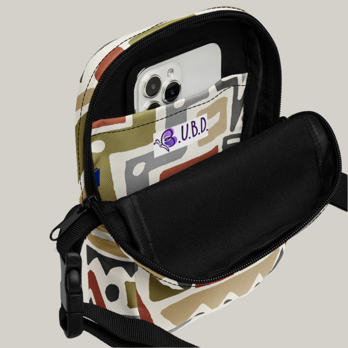 Inside view of Manly Tribal Tune Utility Crossbody Bag in beige and tan print