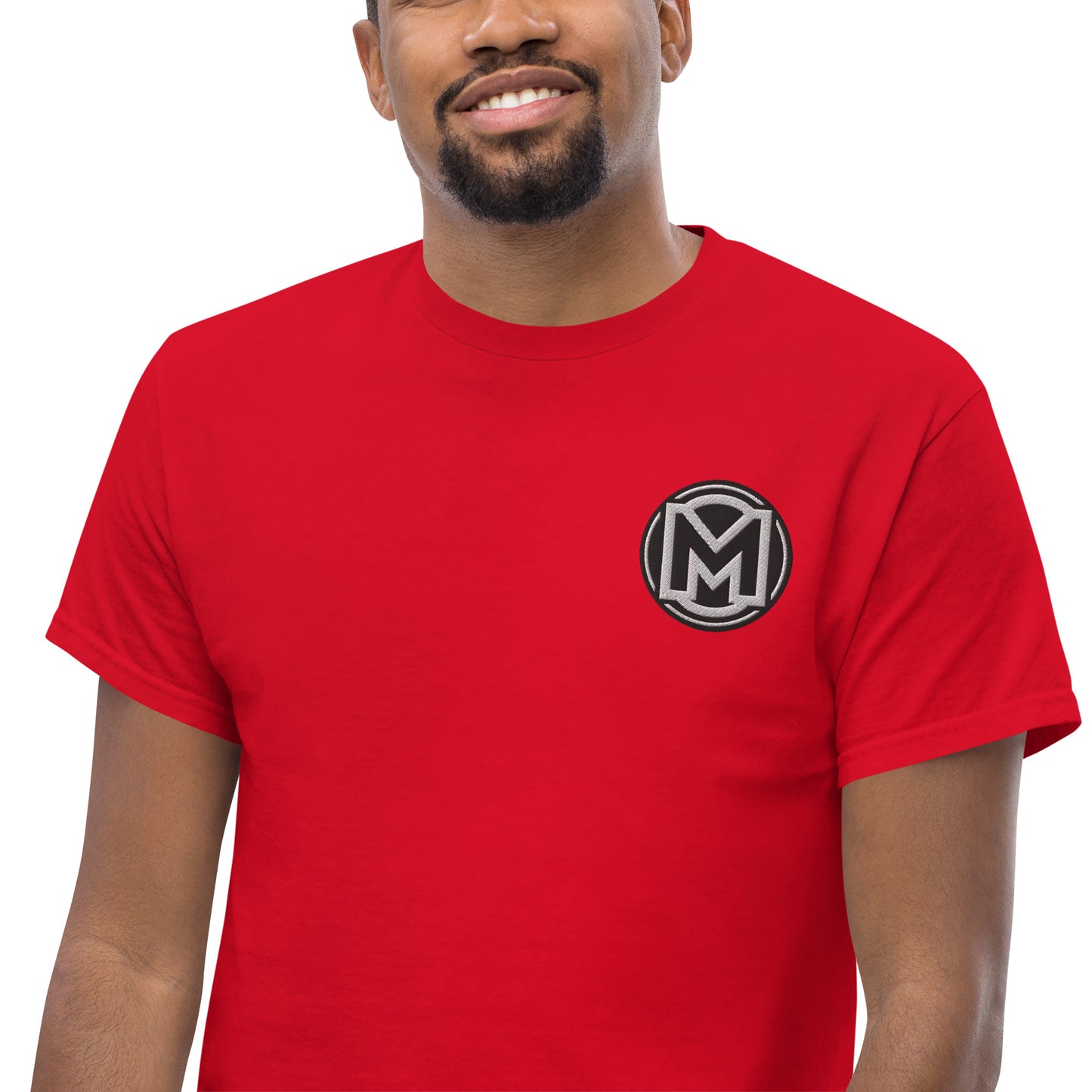 Front of red Manly t-shirt with M logo on chest
