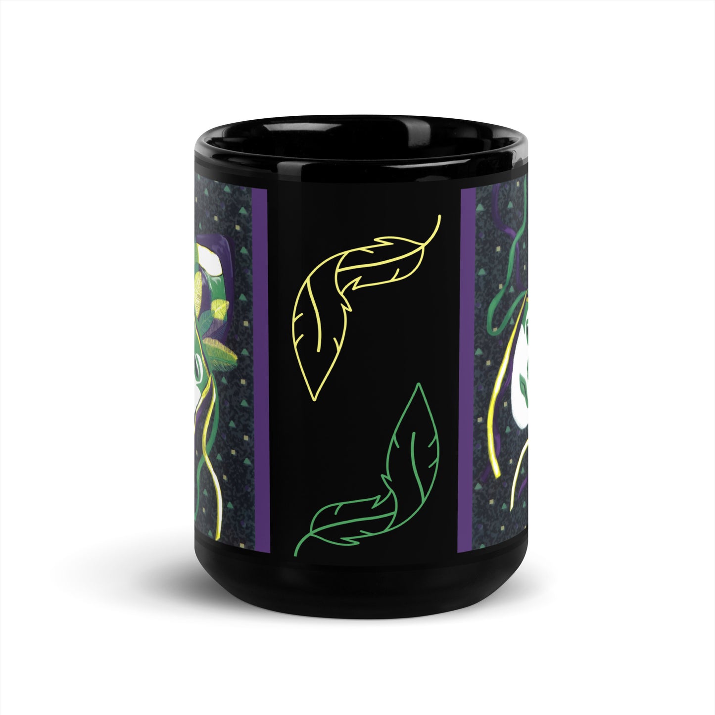 Front view of a black glossy mug with yellow (top) and green (bottom) feathers and a partial view of purple, green, yellow and white confetti and masked images