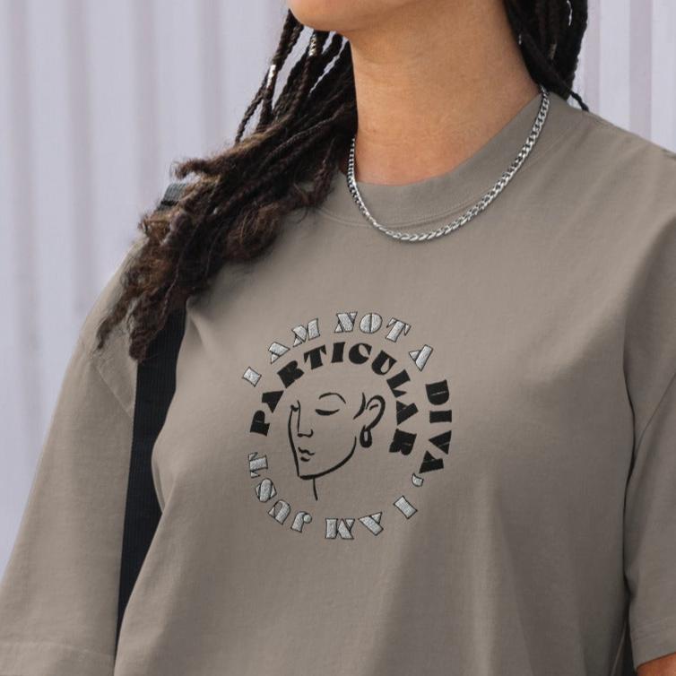 Front of grey t-shirt with image of woman's face and text saying 'I am not a diva, I am just particular'