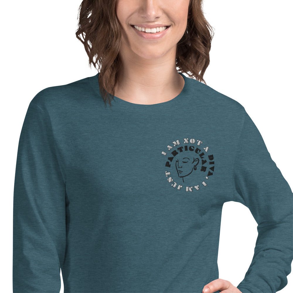 Front of deep teal long sleeved t-shirt with image of woman's face and text saying 'I am not a diva, I am just particular'