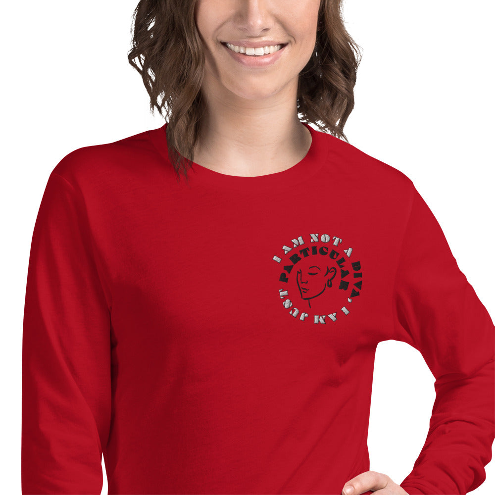 Front of red long sleeved t-shirt with image of woman's face and text saying 'I am not a diva, I am just particular'