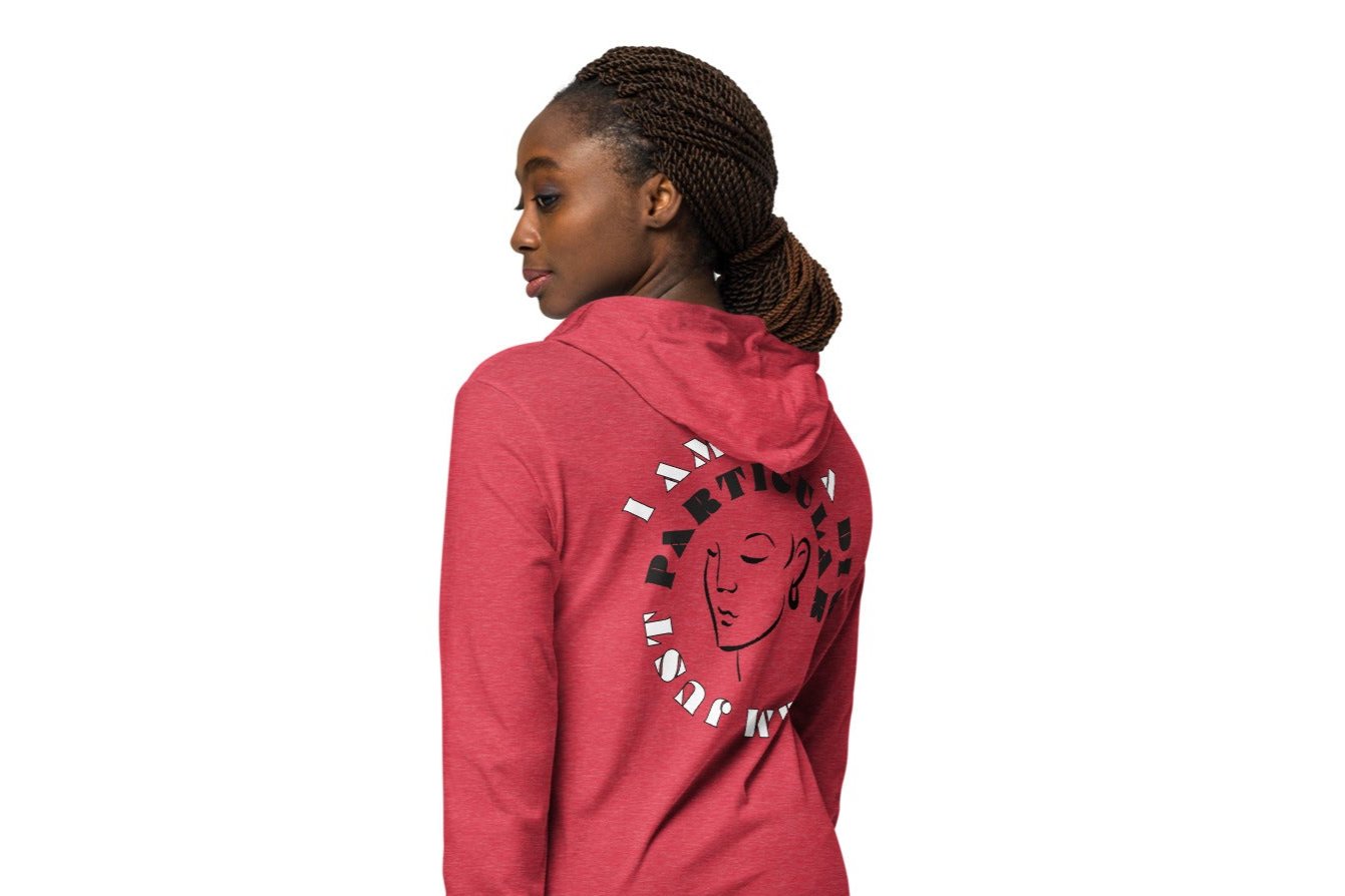 Back of red hoodie tee with black image of woman's face encircled by black and white text saying 'I am not a diva, I am just particular'