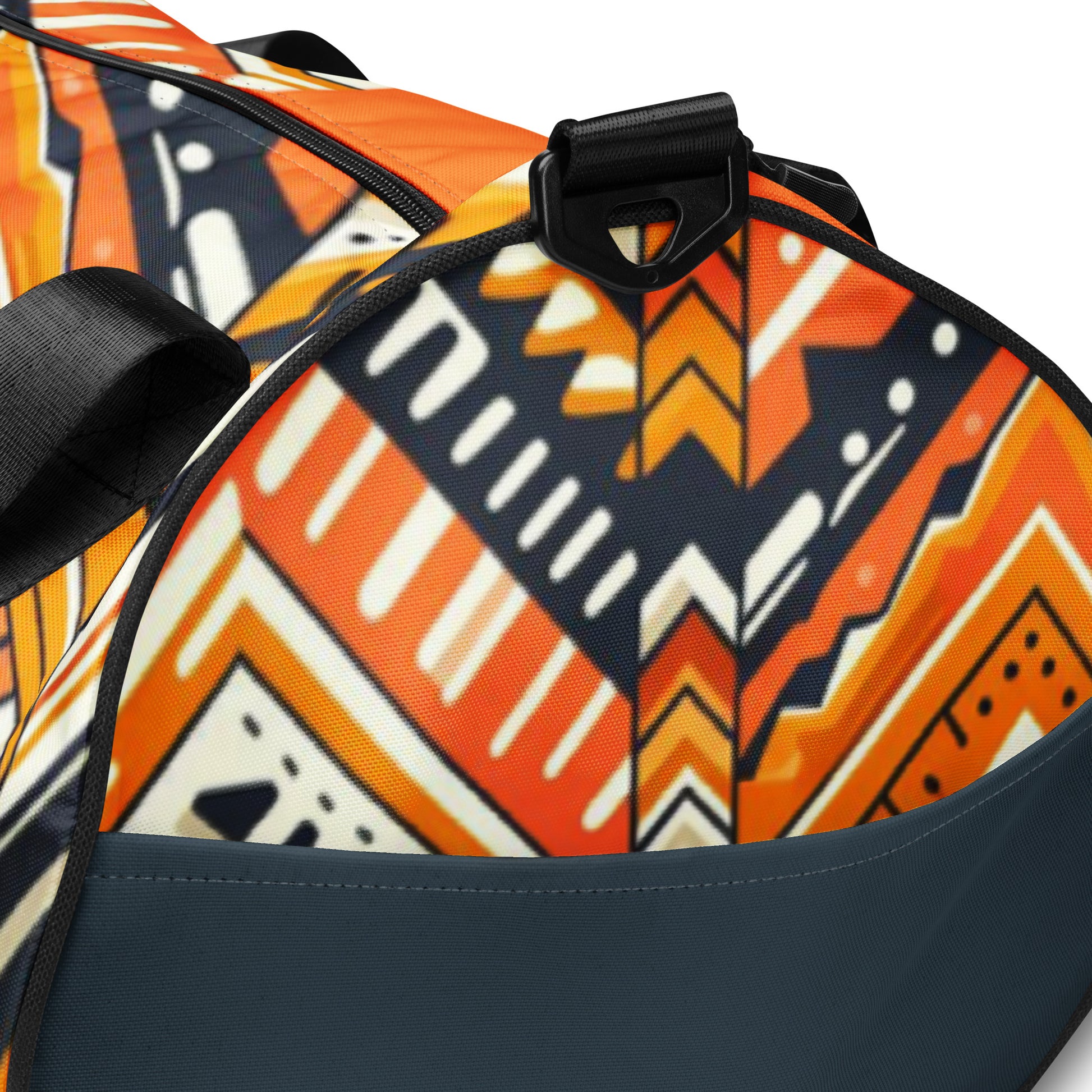 Details of orange and navy Aztec print gym bag