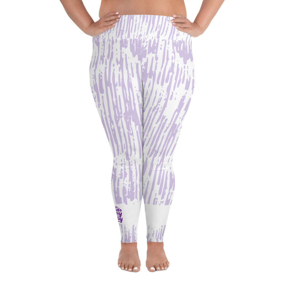 Front view of purple and white print leggings with purple text around bottom right leg saying 'Praise Pray Slay'